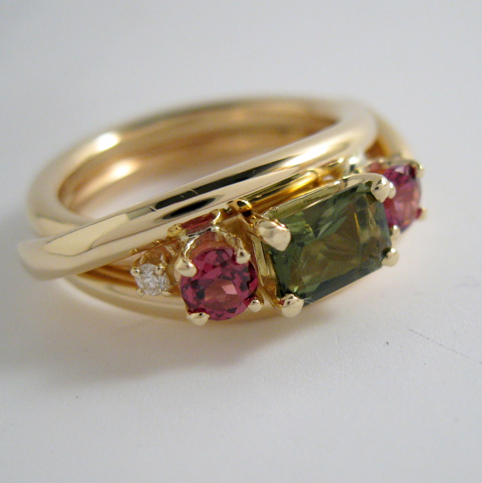 cowboy ring in 14k with moldivite, garnet and diamond
